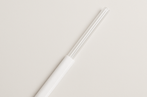 10.25 clear straw, sticking out halfway out of a white paper wrapper.