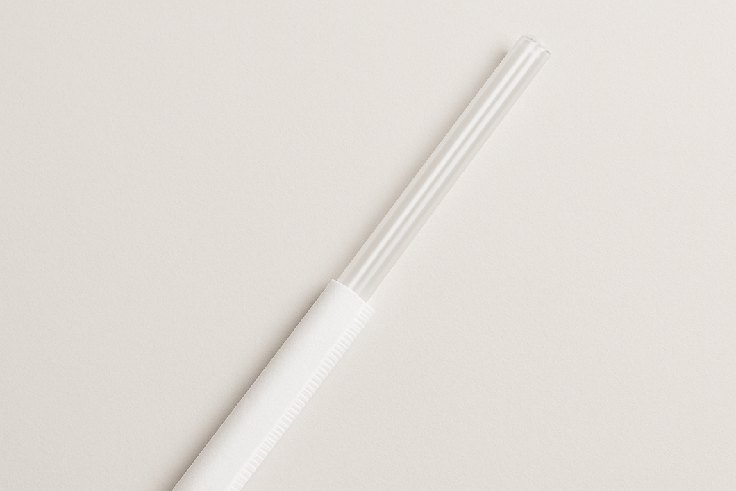 10.25 clear straw, sticking out halfway out of a white paper wrapper.